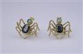 A pair of 18k gold earrings formed as spiders. - image-1