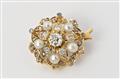 A 14k gold, diamond and pearl brooch. - image-1