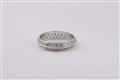 An 18k white gold and diamond eternity ring - image-1