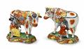 Two Delft faience figures of a lady and gentleman milking cows - image-1