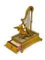 A fire-gilt bronze musical box formed as a putti playing a harp - image-2