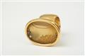 An 18k gold and rock crystal capsule ring filled with water and diamonds by Falko Marx - image-2