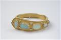 A gold and opal bangle with granulated decor - image-2
