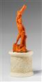 A carved red coral figure of Saint Sebastian on an ivory plinth - image-2