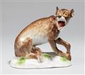 A Meissen porcelain model of a seated wolf - image-1