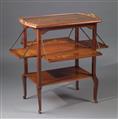 A bronze-mounted Louis Majorelle mahogany and satinwood tea table - image-1
