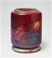 A cylindrical copper-red feldspar glazed stoneware vase - image-1