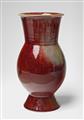 A copper-red feldspar glazed stoneware vase - image-1