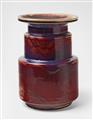 A tiered copper-red feldspar glazed stoneware vase - image-1