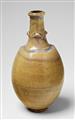 A small beige feldspar glazed stoneware vase - image-1