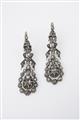A pair of silver and diamond pendant earrings - image-1