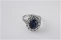 An 18k white gold and sapphire cluster ring - image-1