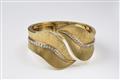 An 18k gold and diamond cuff bangle - image-1
