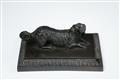 A cast iron paperweight formed as a German Spaniel - image-1