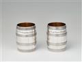 A pair of Stettin silver barrel beakers - image-1