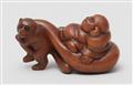 A boxwood netsuke of Hotei being pulled by a tanuki. 19th century - image-1
