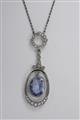 A Belle Epoque platinum, natural sapphire and diamond pendant - image-1
