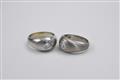 A pair of 18k white gold engagement rings - image-1