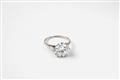 A platinum and diamond solitaire ring - image-2