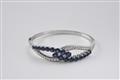 An 18k white gold and sapphire bangle - image-2