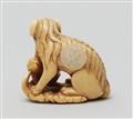 An ivory netsuke of a long-haired dog. Early 19th century - image-2