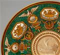 A Berlin KPM porcelain plate with green porphyry ground and trophies - image-2