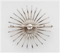 A 14k white gold sun brooch with a diamond solitaire - image-2