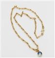 An 18k gold and sapphire pendant - image-2