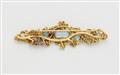 An 18k gold floral brooch with blue topaz - image-2