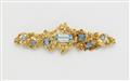 An 18k gold floral brooch with blue topaz - image-1
