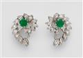 A pair of 14k white gold and emerald clip earrings - image-1