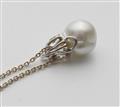 An 18k white gold pearl and diamond demi-parure - image-3