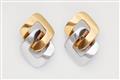 A pair of 18k white and yellow gold earclips - image-1