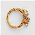 An 18k gold pearl and coloured stone bangle with lion's head motifs - image-2