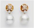 A pair of 18k gold, pearl and fancy diamond earrings - image-1