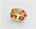 An 18k gold gemstone intaglio bangle - image-1