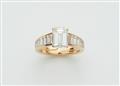 An 18k gold Cartier ring with an emerald-cut diamond solitaire - image-1