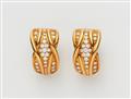 A pair of 18k gold diamond clip earrings - image-1