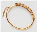 A Belle Epoque 14k gold sapphire and diamond bangle - image-2