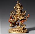 A Tibetochinese gilt bronze figure of Jambhala. Late 19th century - image-1