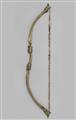 A brass bow with animal fur - image-4