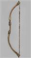 A brass bow with animal fur - image-1