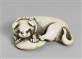 An ivory netsuke of a dog with a blow fish. Early 19th century - image-1