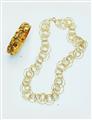 An 18k gold gemstone bangle - image-5