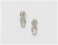 A pair of 14k gold diamond solitaire earrings - image-1
