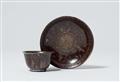 A Meissen porcelain tea bowl and saucer with rare “hausmaler” decoration - image-1