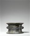 An Iranian mortar and pestle with floral reliefs - image-1