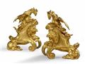 A pair of ormolu fire dogs with lions and dragons - image-1