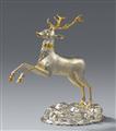 A parcel gilt silver drinking vessel in the form of a stag - image-1