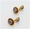 A pair of 18k gold sapphire cufflinks - image-1